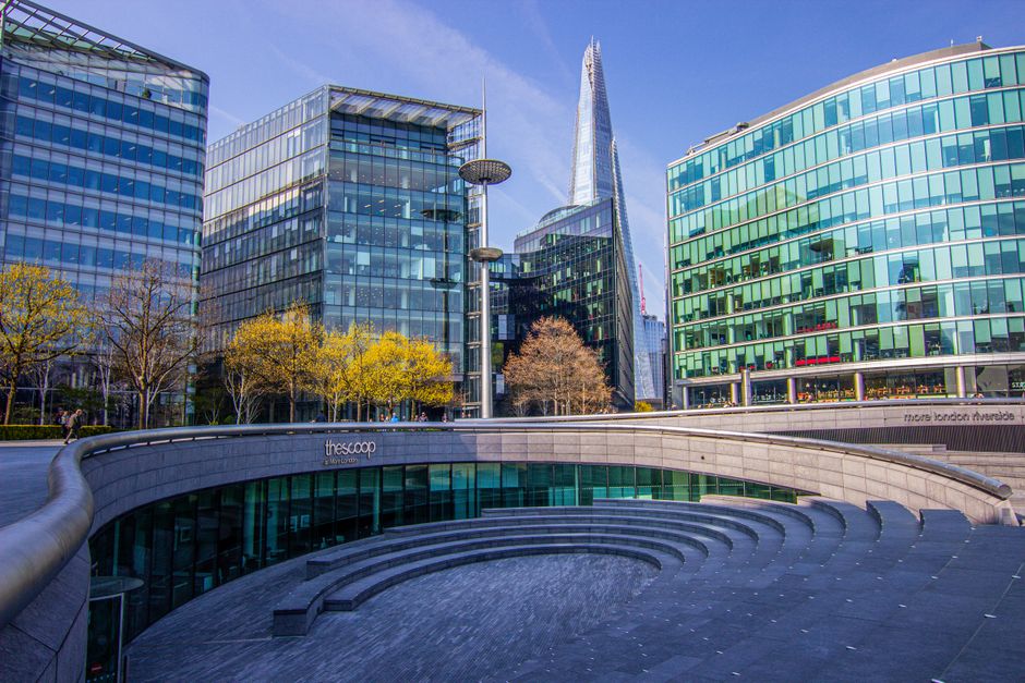 A view of The Scoop amphitheatre with modern buildings, including The Shard, in London, UK.