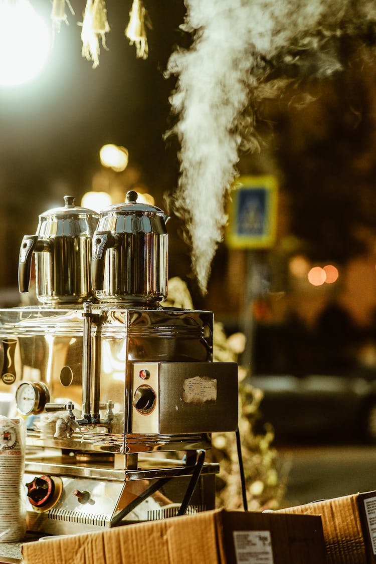 Steamy Coffee Jugs On City Street Market