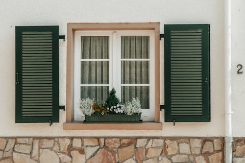 Close-up of a Window with Wooden Shutters 