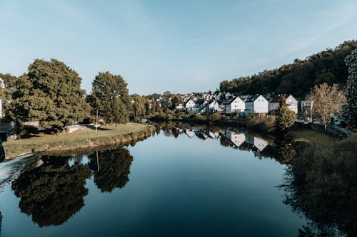 Houses along the River in a Town in Summer 