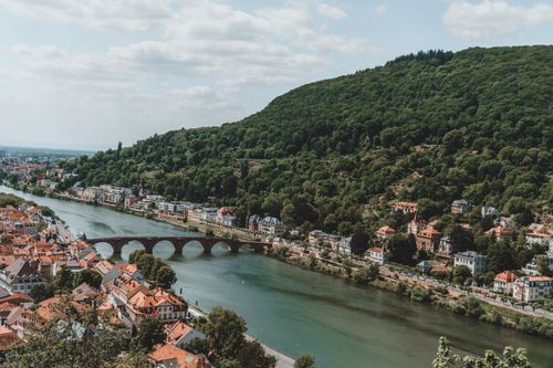 Free Explore the scenic aerial view of Heidelberg with its iconic Karl Theodor Bridge over the Neckar River. Stock Photo