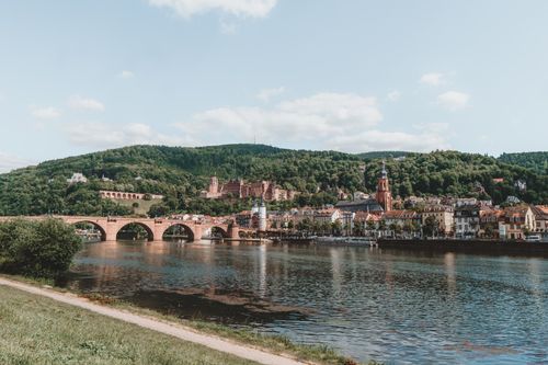 Free A picturesque view of Heidelberg with the historic Karl Theodor Bridge spanning over the Neckar River. Stock Photo