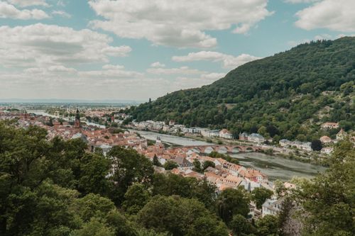 Free Aerial view of Heidelberg, Germany with Neckar River and hills in summer. Stock Photo