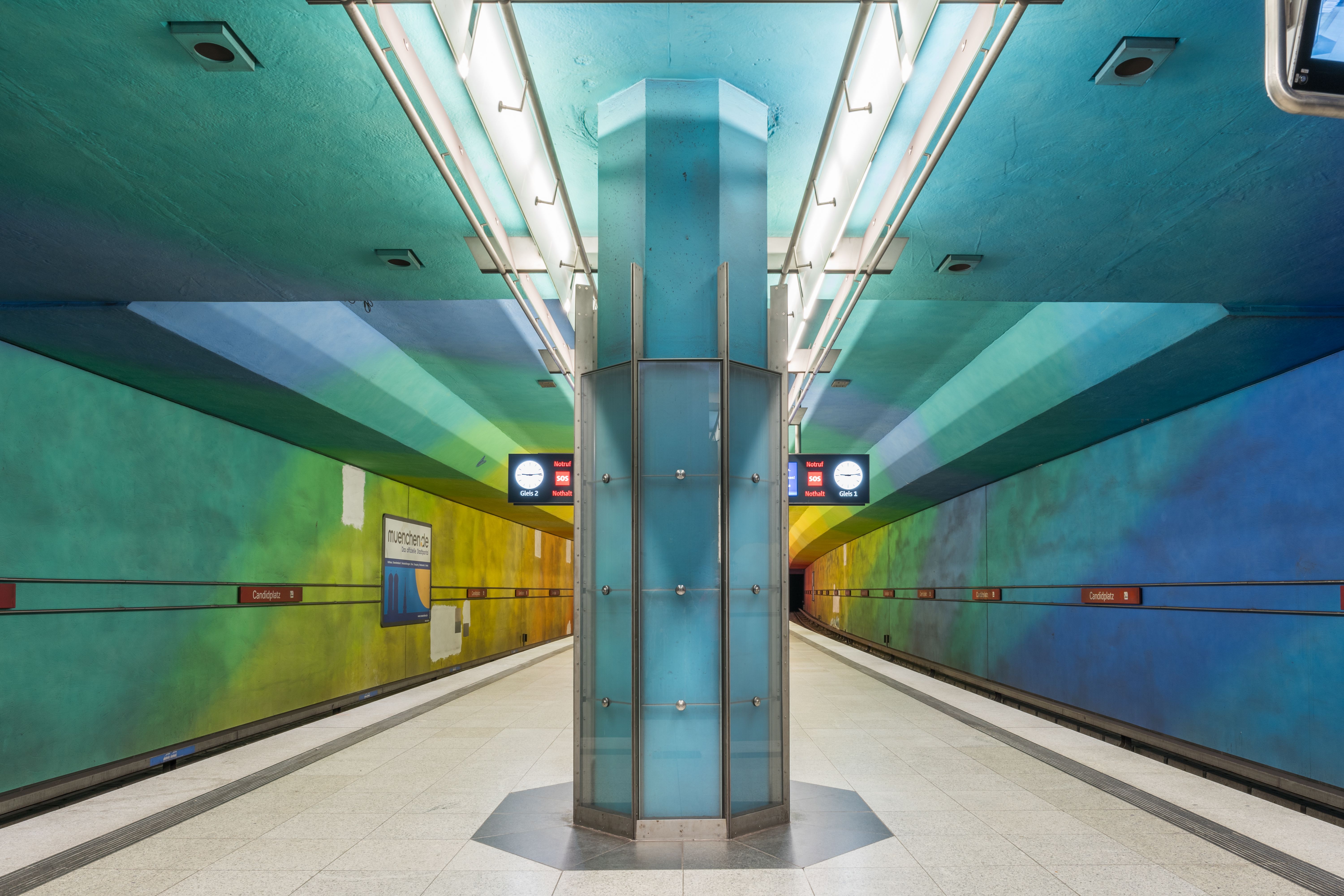 A colorful and modern subway station with striking architectural design.