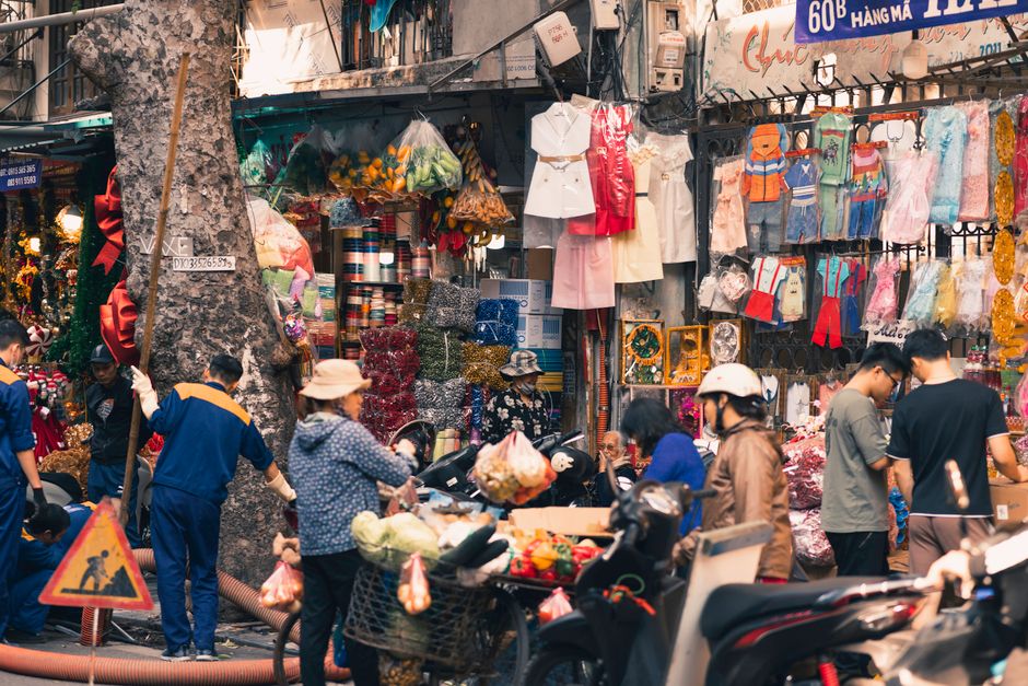 People bundled up on a street in Hanoi during winter in Vietnam