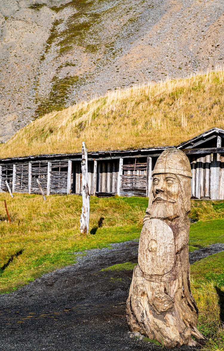 Wooden Viking Warrior Statue Near Village House