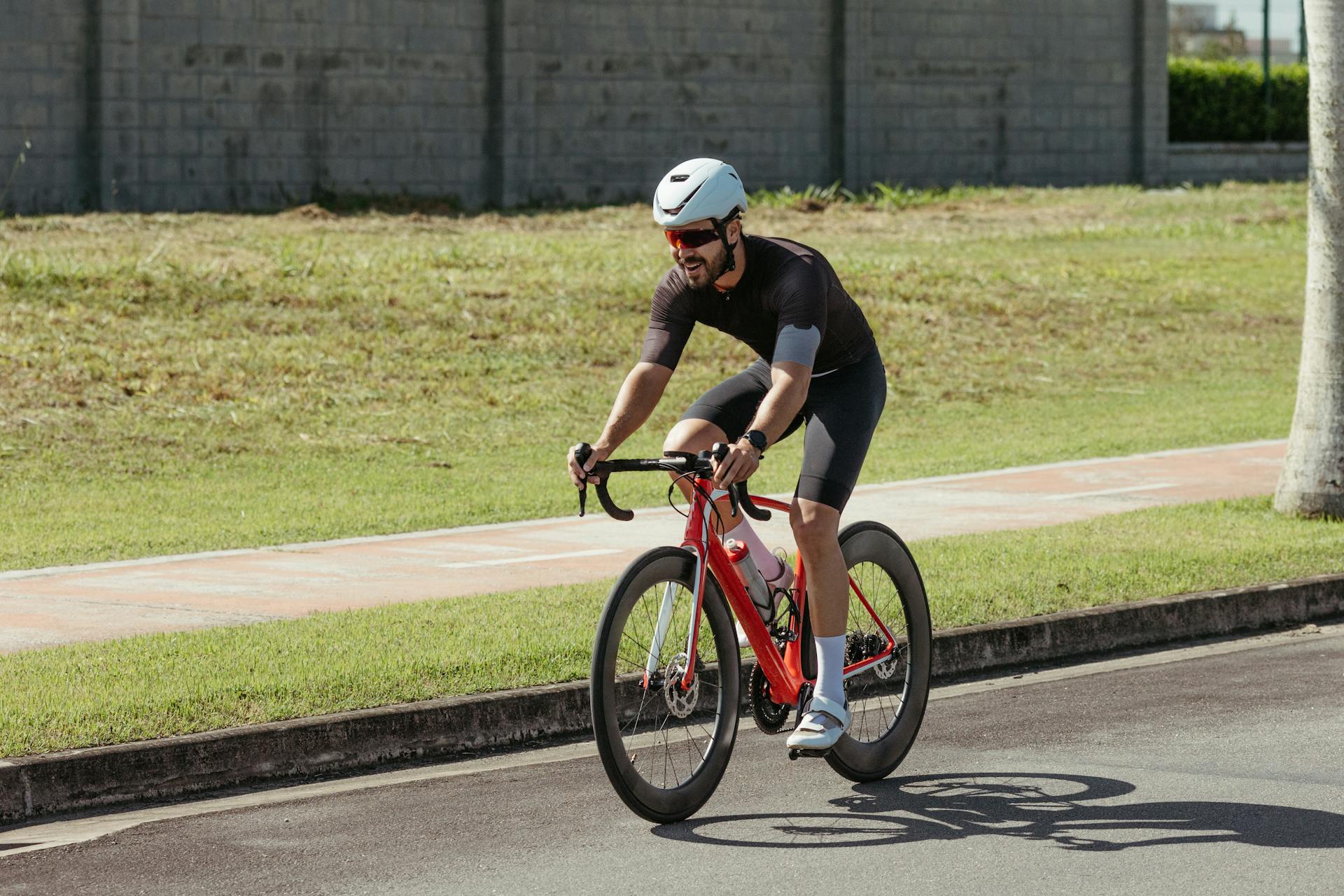 A man riding a bike on a road