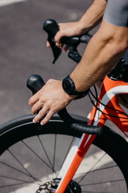 Free Close-up of cyclist's hands holding the handlebars of a racing bike on a sunny day. Stock Photo