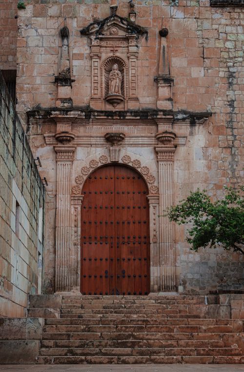 Free Gothic style doorway on a historic stone building in Oaxaca, Mexico. Stock Photo