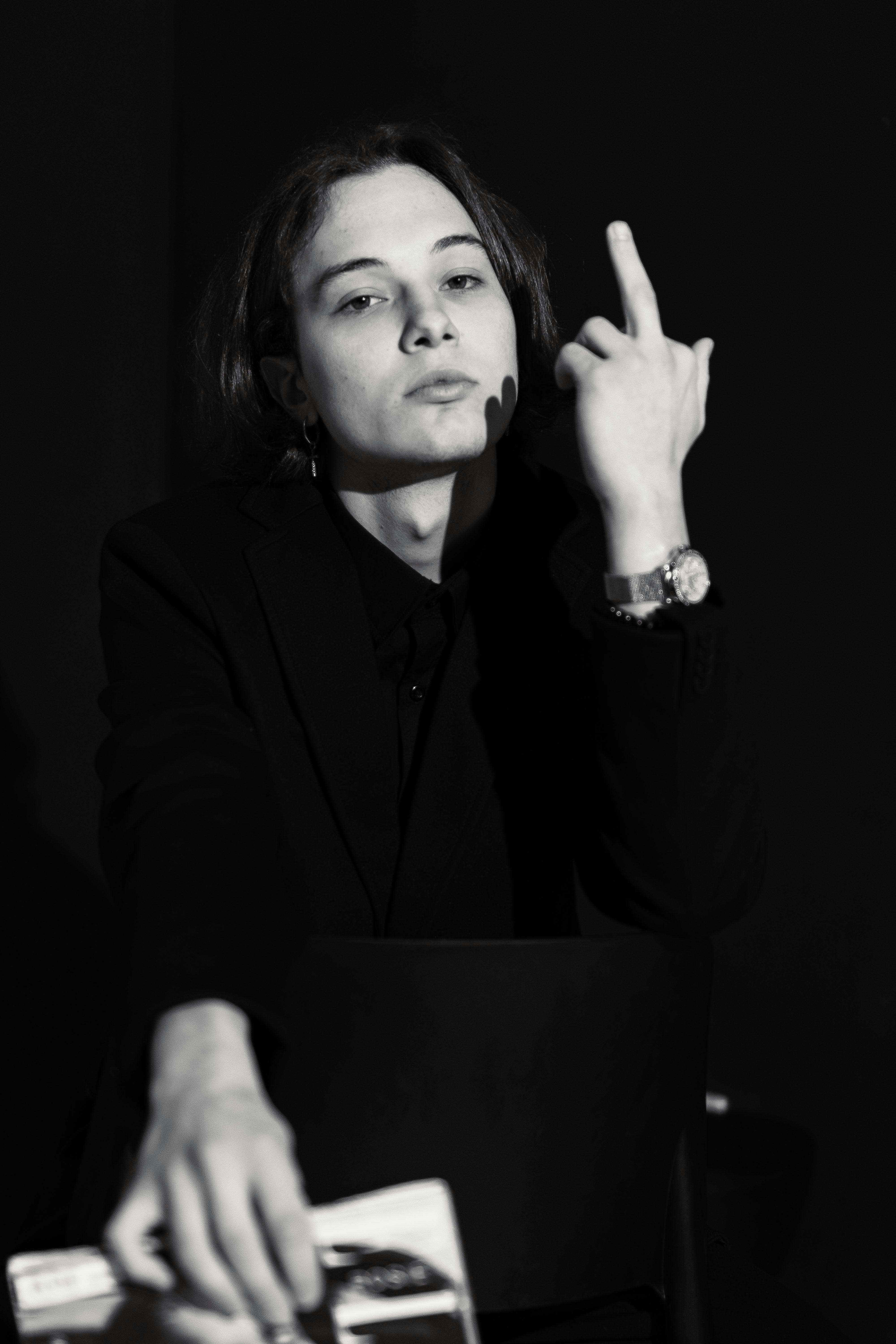 Woman Showing Middle Finger in Black and White · Free Stock Photo