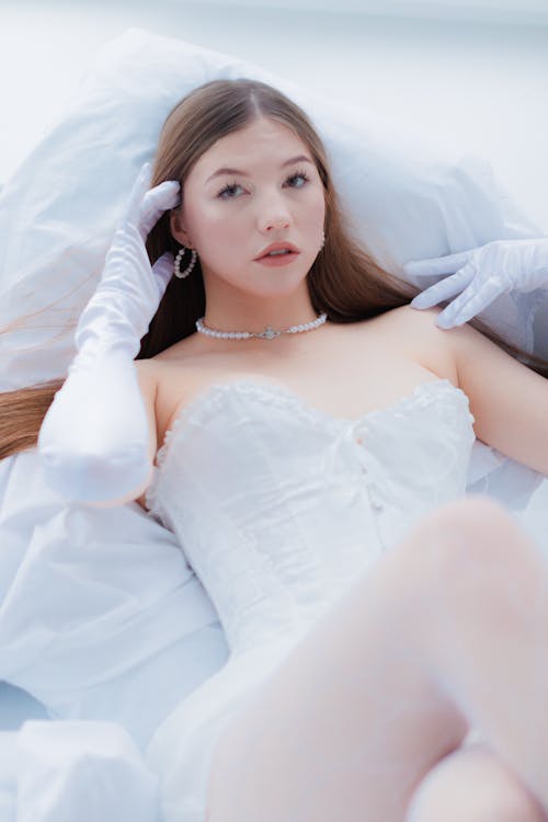 Bride Lying Down in Wedding Dress