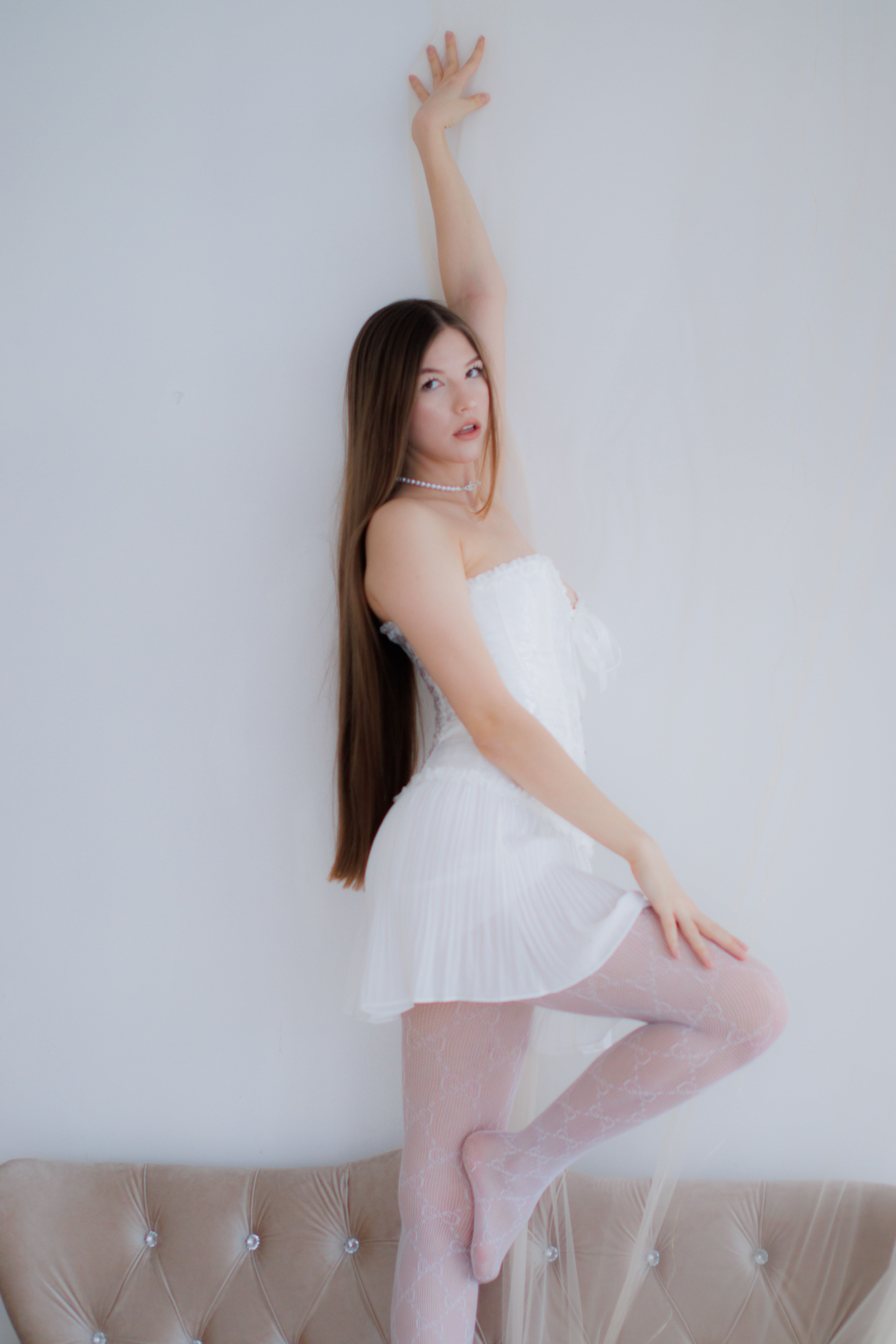Woman in White Dress Standing with Arm Raised · Free Stock Photo