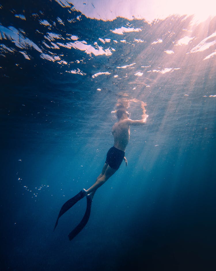 Man Diving In Sea