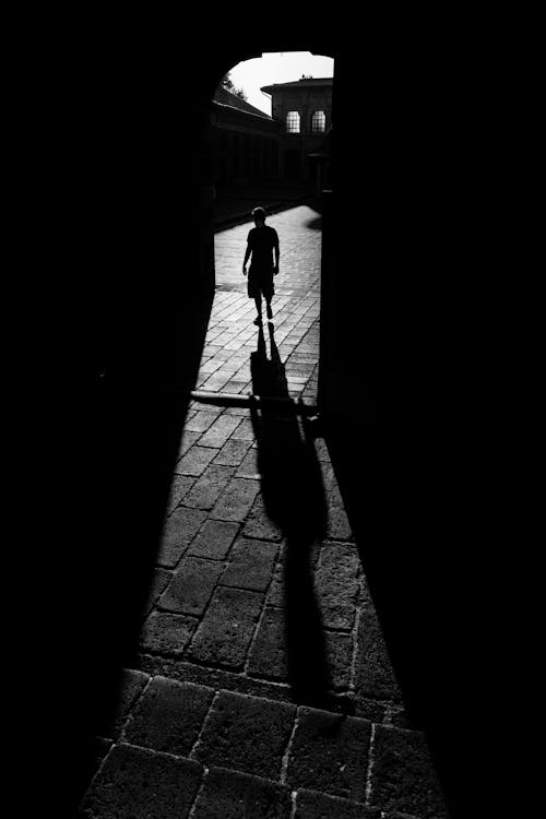 Man in a Tunnel in Shadow in Black and White 