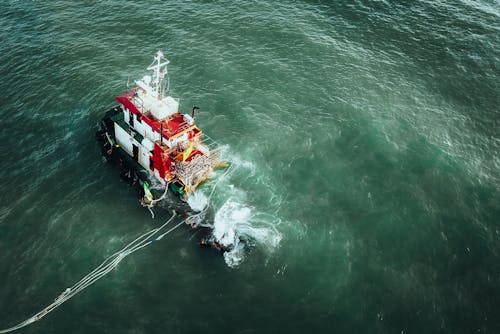 Drone Shot of Sunken, Moored Fishing Boat on Coast