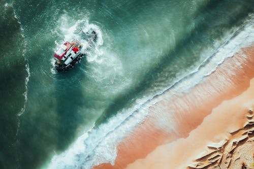 Free Aerial View of a Shipwreck near the Shore Stock Photo