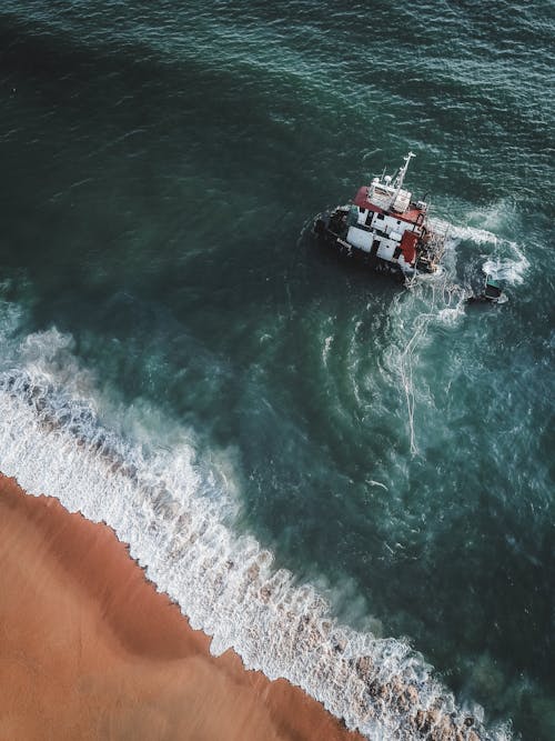 Free Aerial View of a Shipwreck near the Shore Stock Photo