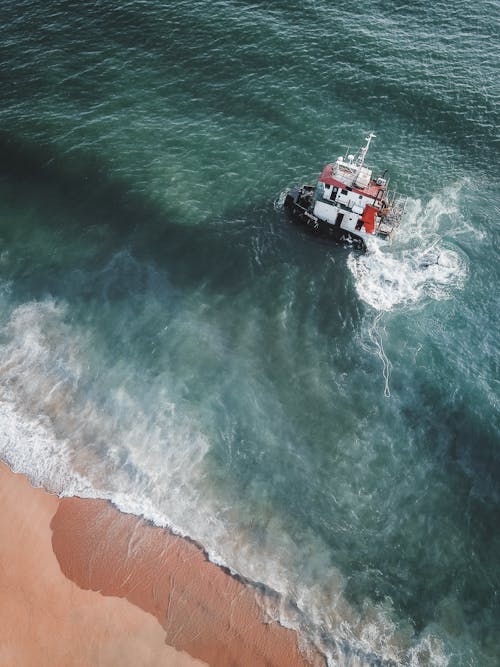 Free Aerial View of a Shipwreck near the Shore Stock Photo