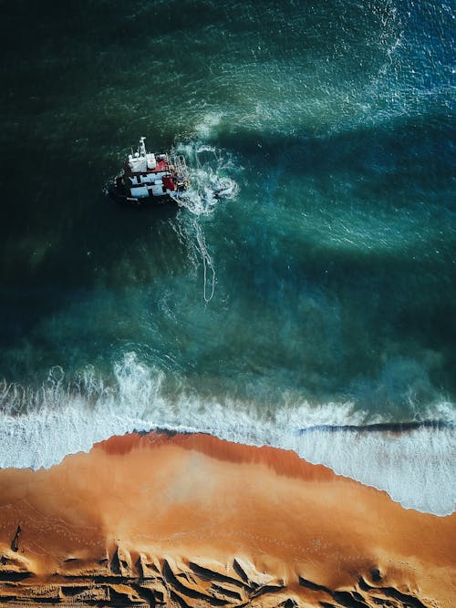 Free Aerial View of a Shipwreck near the Shore Stock Photo