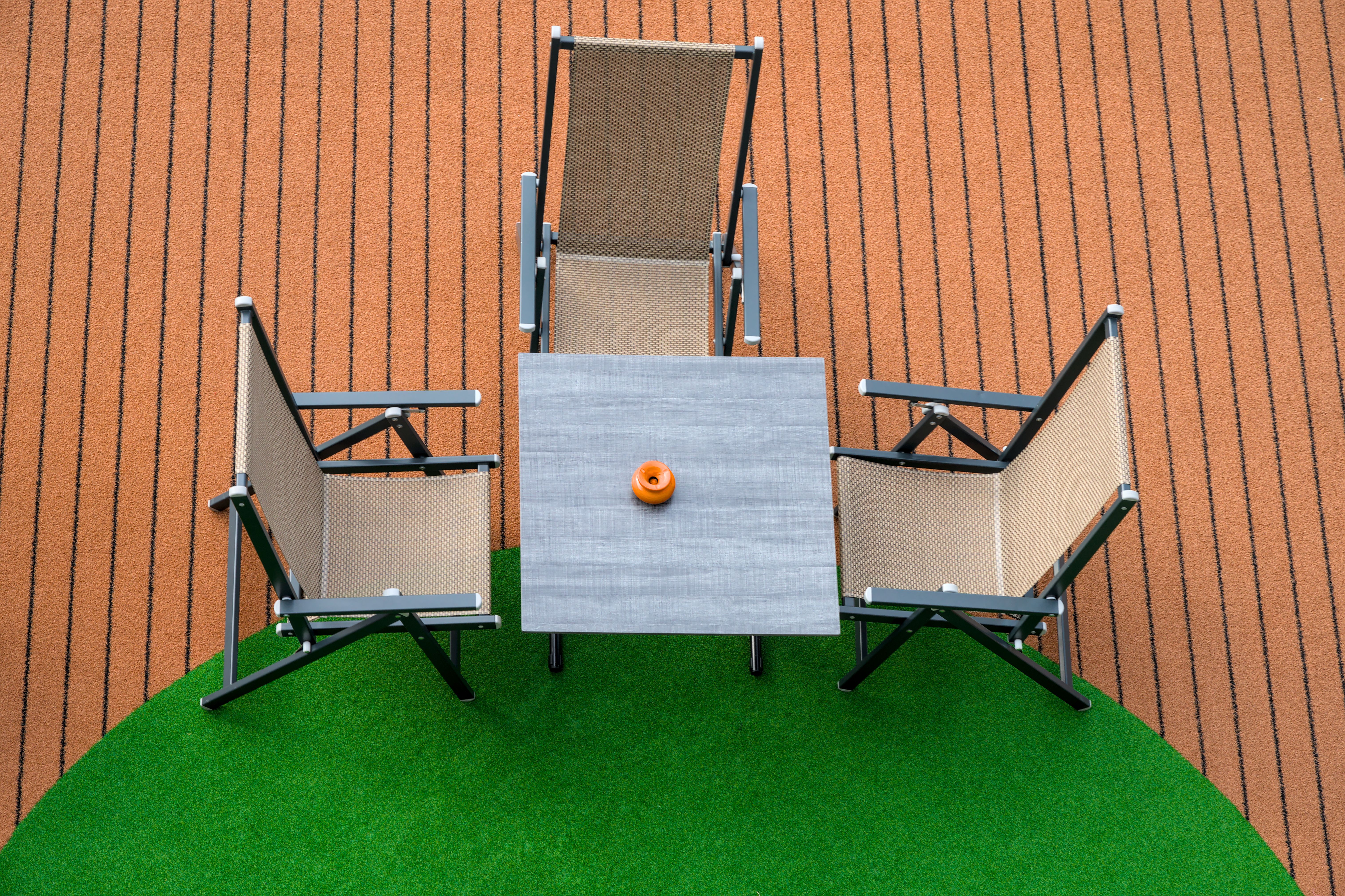 Modern patio furniture on beautiful artificial grass in Southern Utah backyard