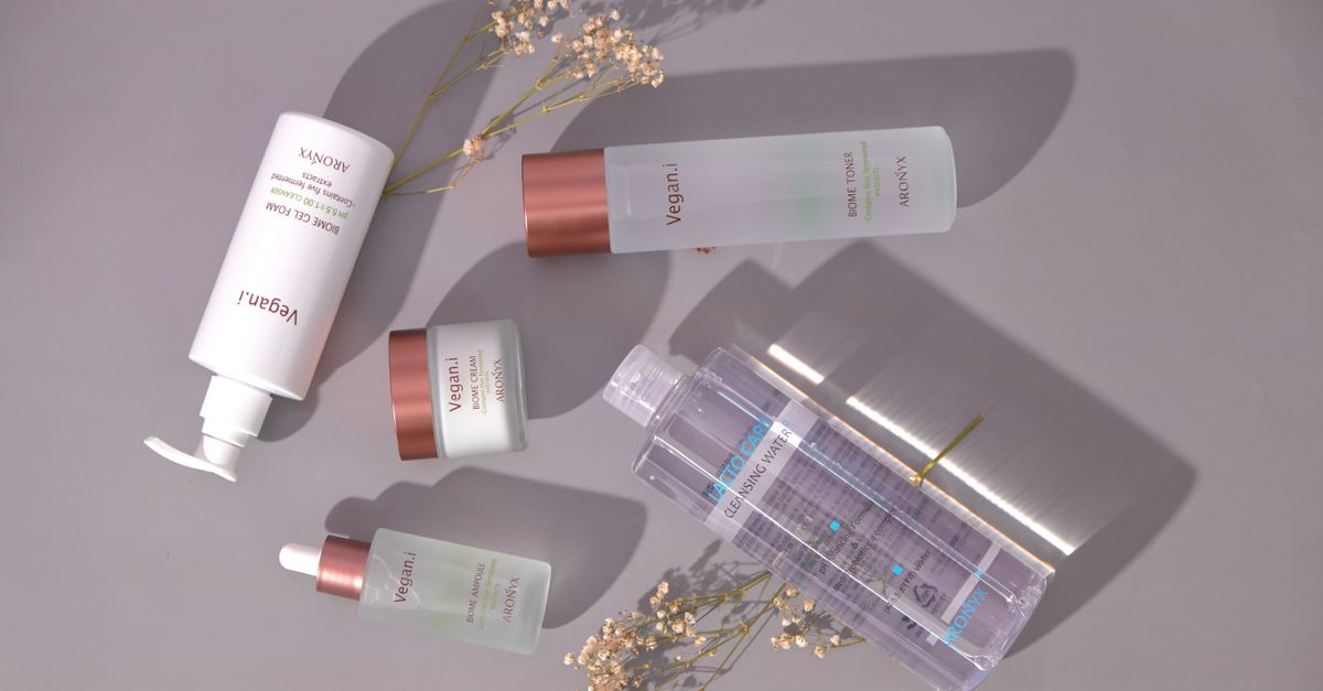 Stylish flat lay of vegan skincare products with a minimalist design.