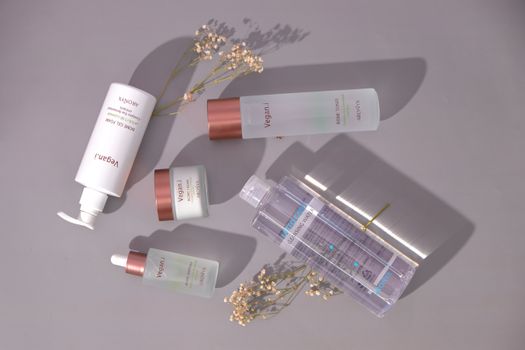 Stylish flat lay of vegan skincare products with a minimalist design.