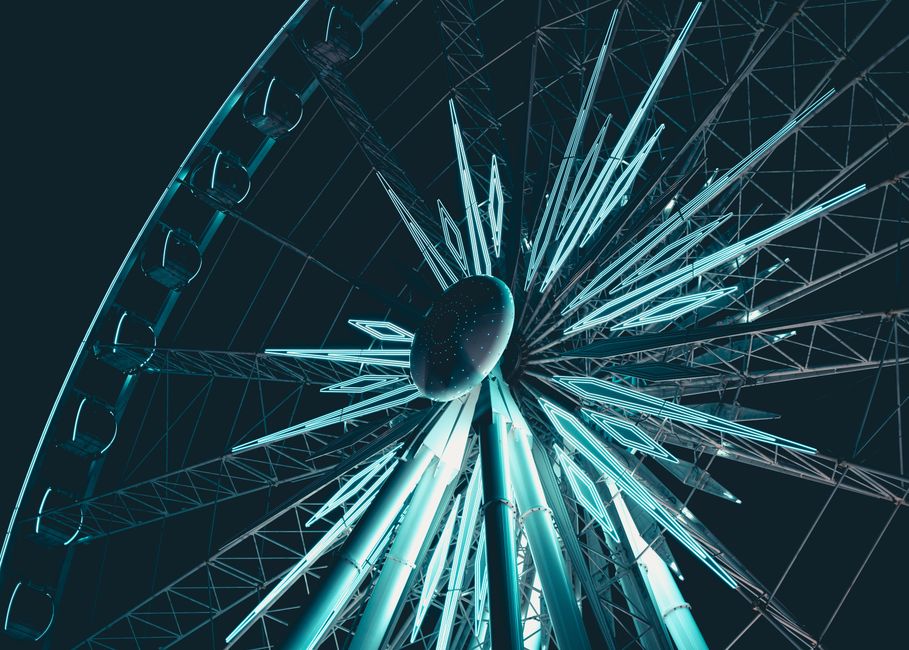 A stunning view of a brightly lit Ferris wheel at night in Niagara Falls, Ontario.