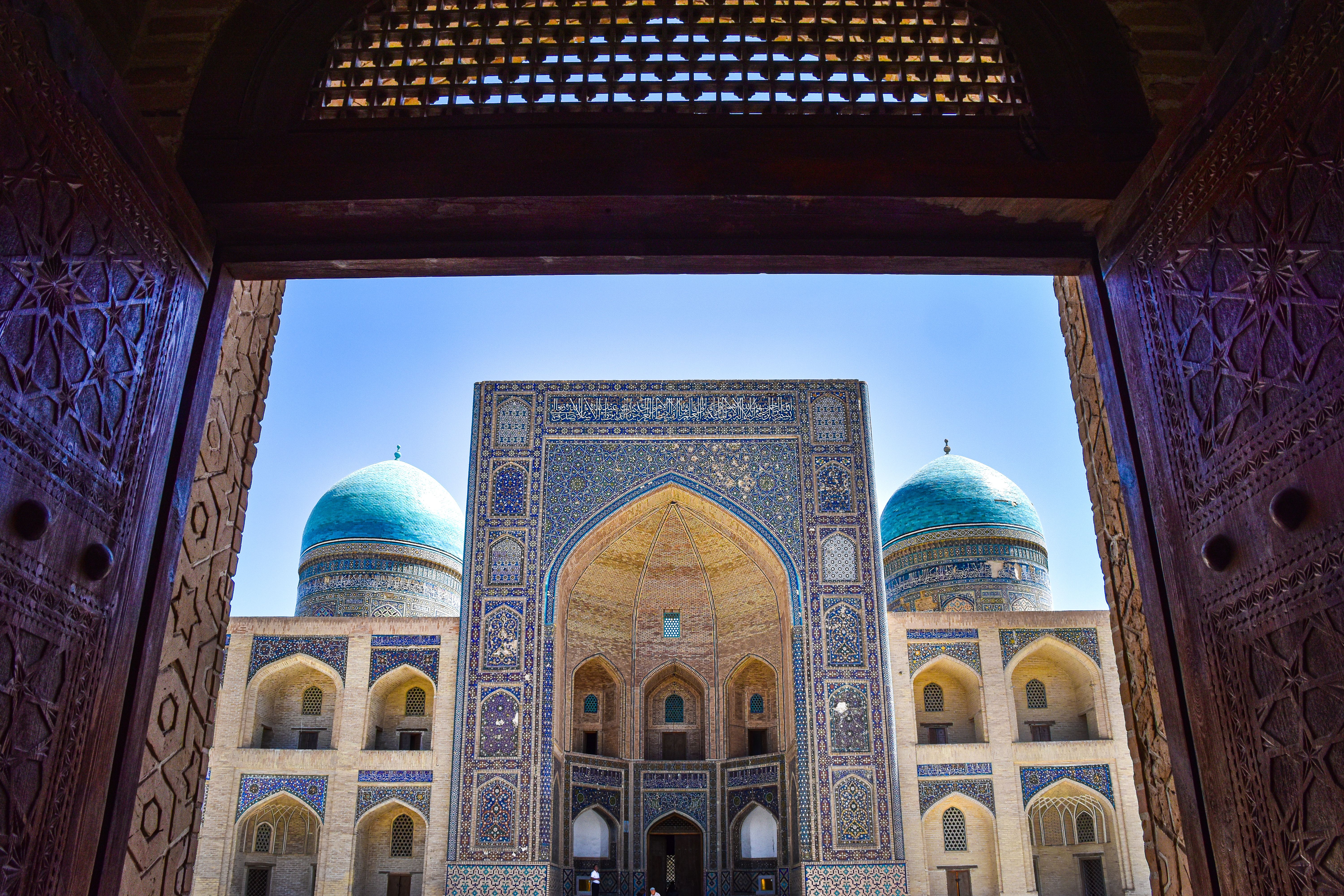 The entrance to a mosque with blue domes · Free Stock Photo