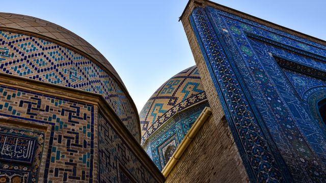 Explore the stunning mosaic patterns and domes of Shah-i-Zinda, a historic Islamic complex in Samarkand, Uzbekistan. — lounges at Samarkand Airport