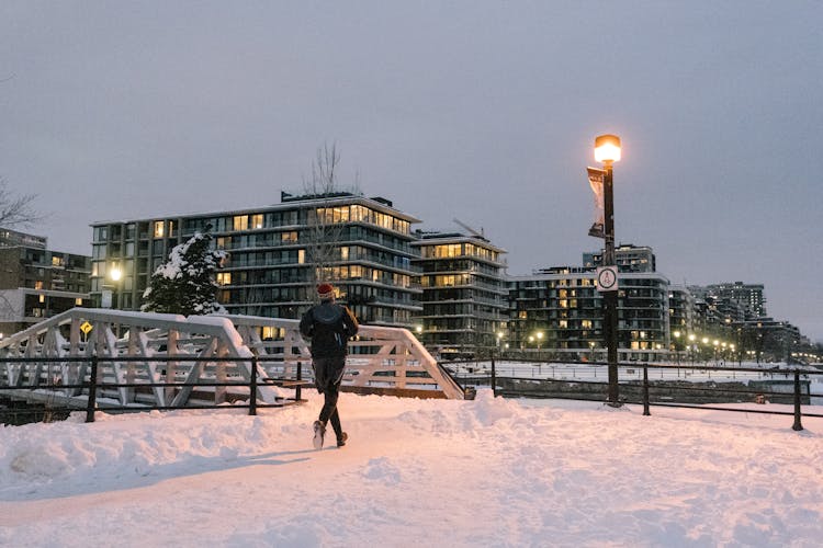 Man Running In City Streeton Winter Day