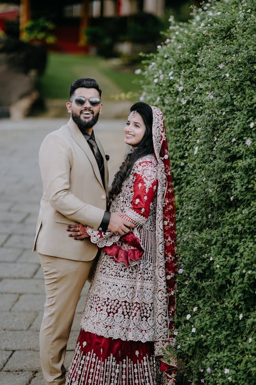 Smiling Bride in Traditional Dress with Groom