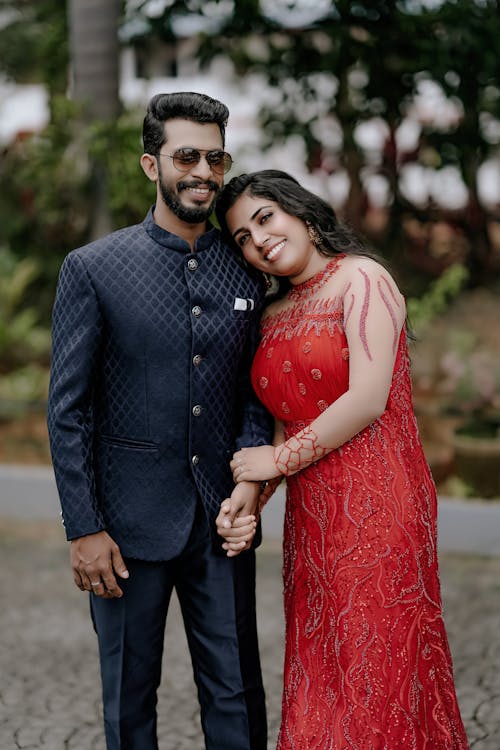 Man and Woman Wearing Elegant Clothing