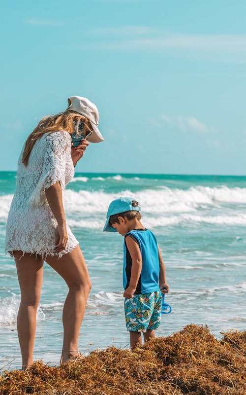 Blonde Woman and Boy on Beach