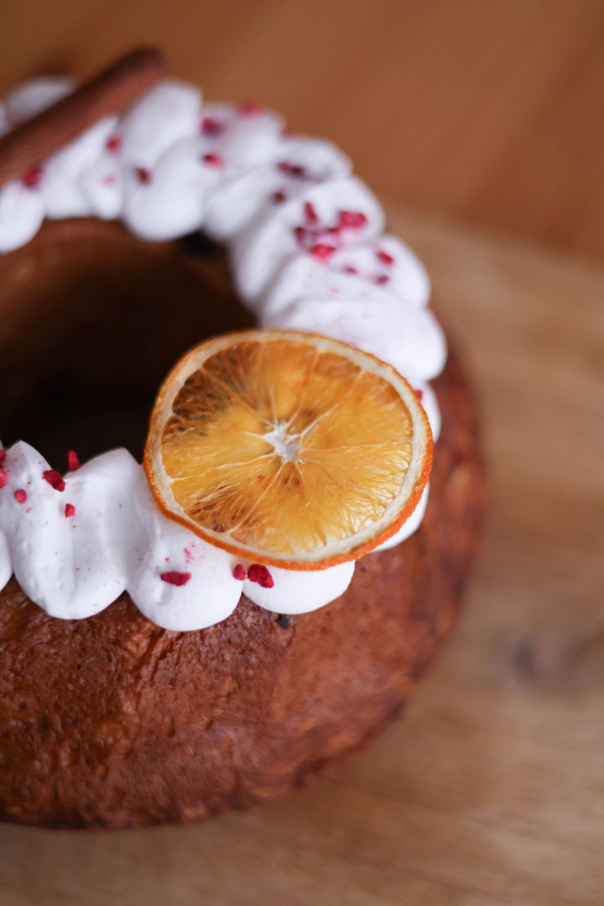 Bundt cake with icing and an orange slice