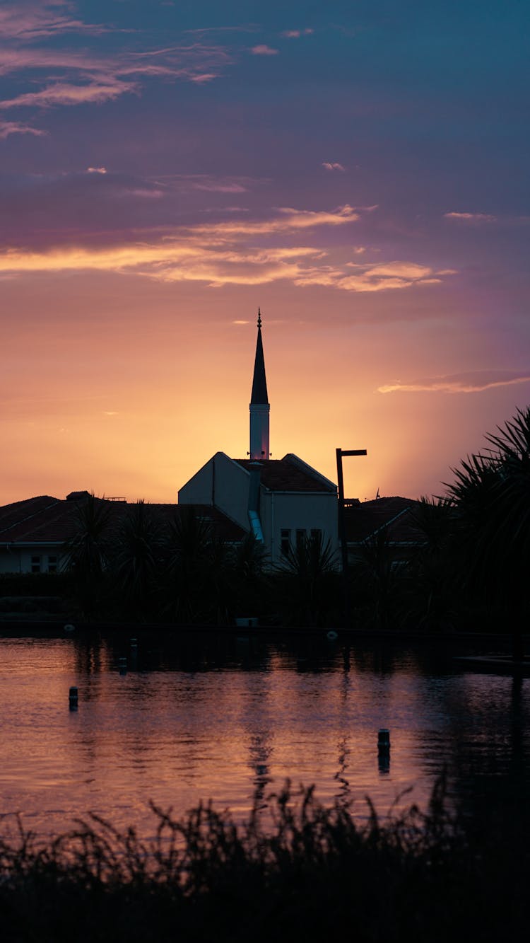 Chapel By The River At Dusk