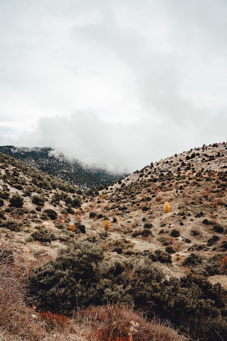 A Photo Of A Mountain Range With Clouds