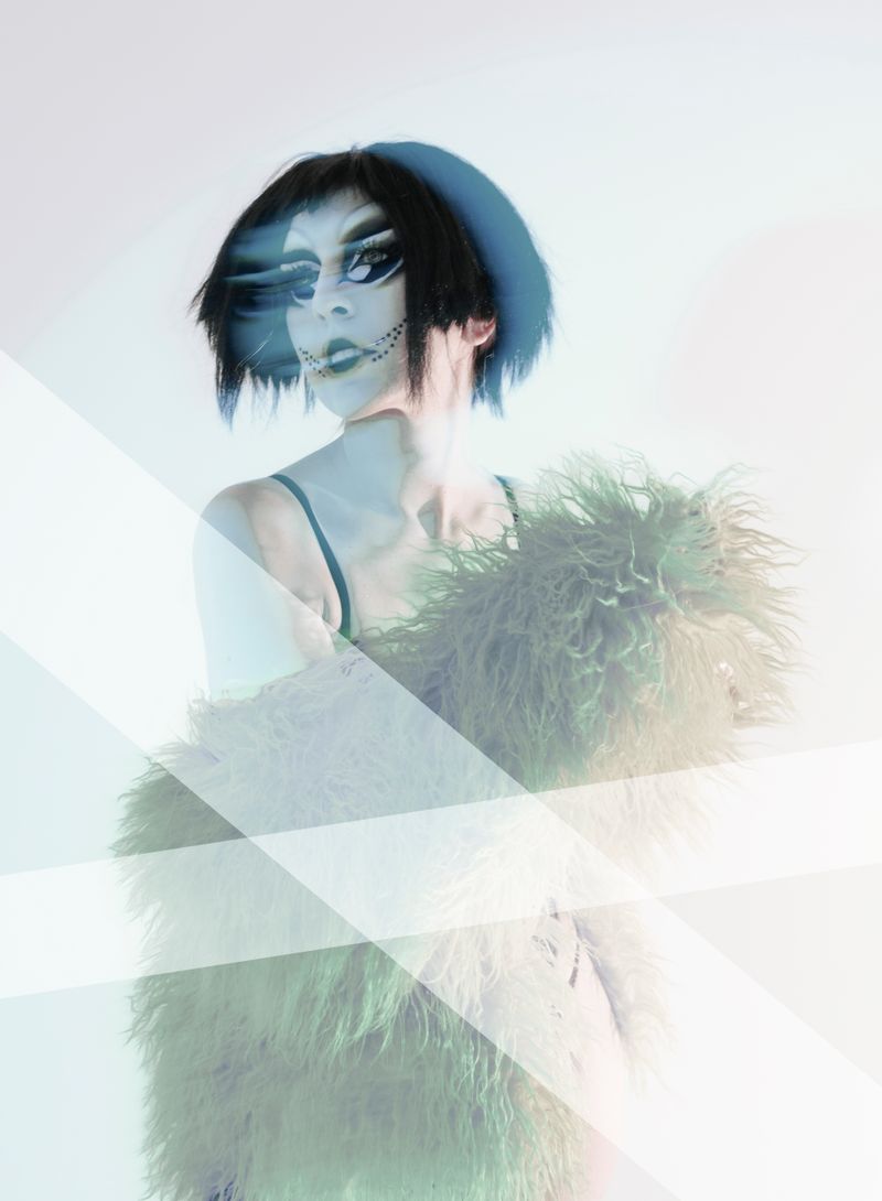Brunette woman in fur coat with dramatic makeup