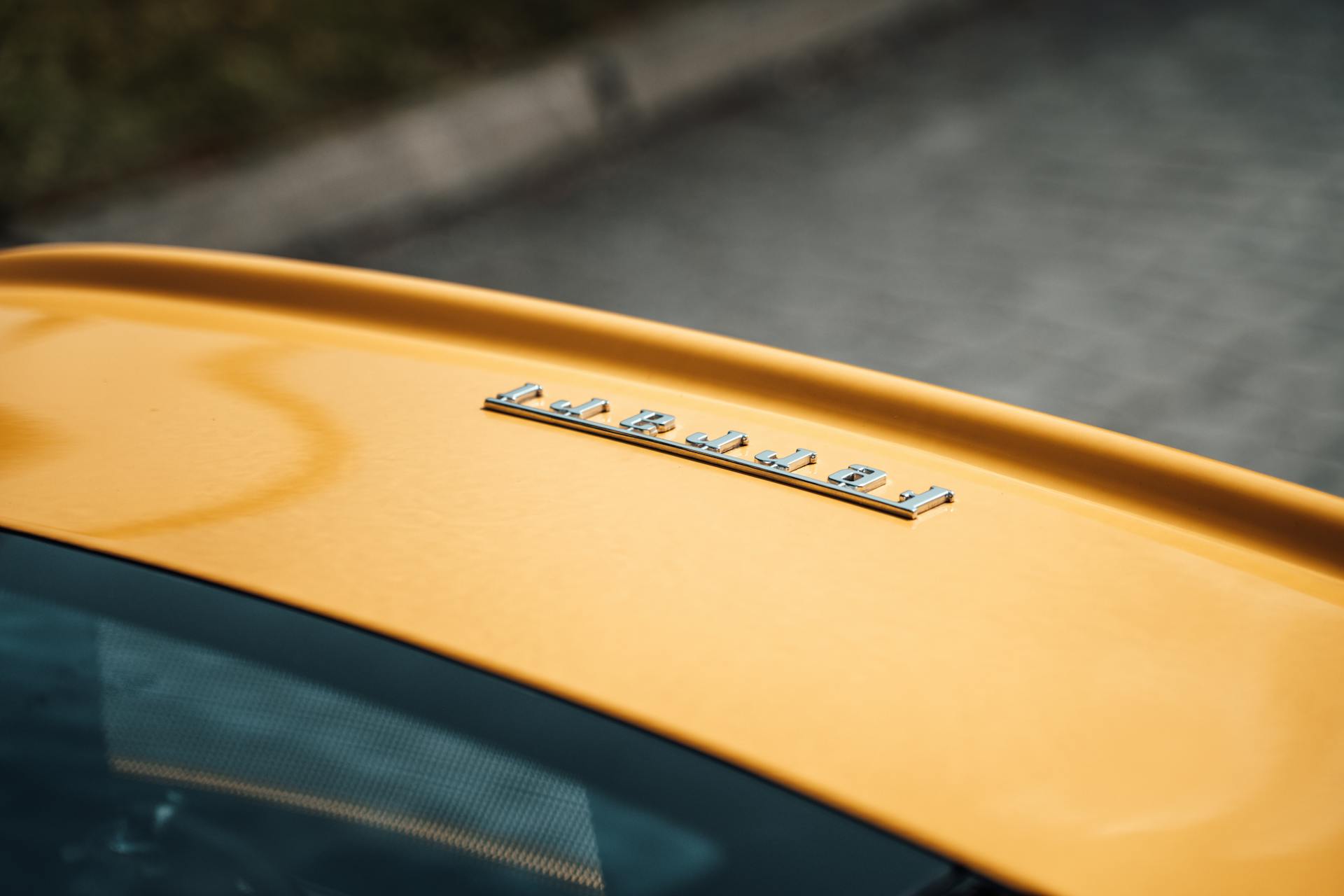 Logo on Yellow Car