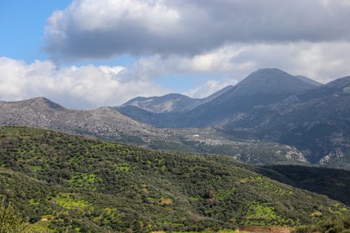 Free Beautiful mountain landscape featuring lush green hills under a partly cloudy sky, capturing the essence of nature. Stock Photo