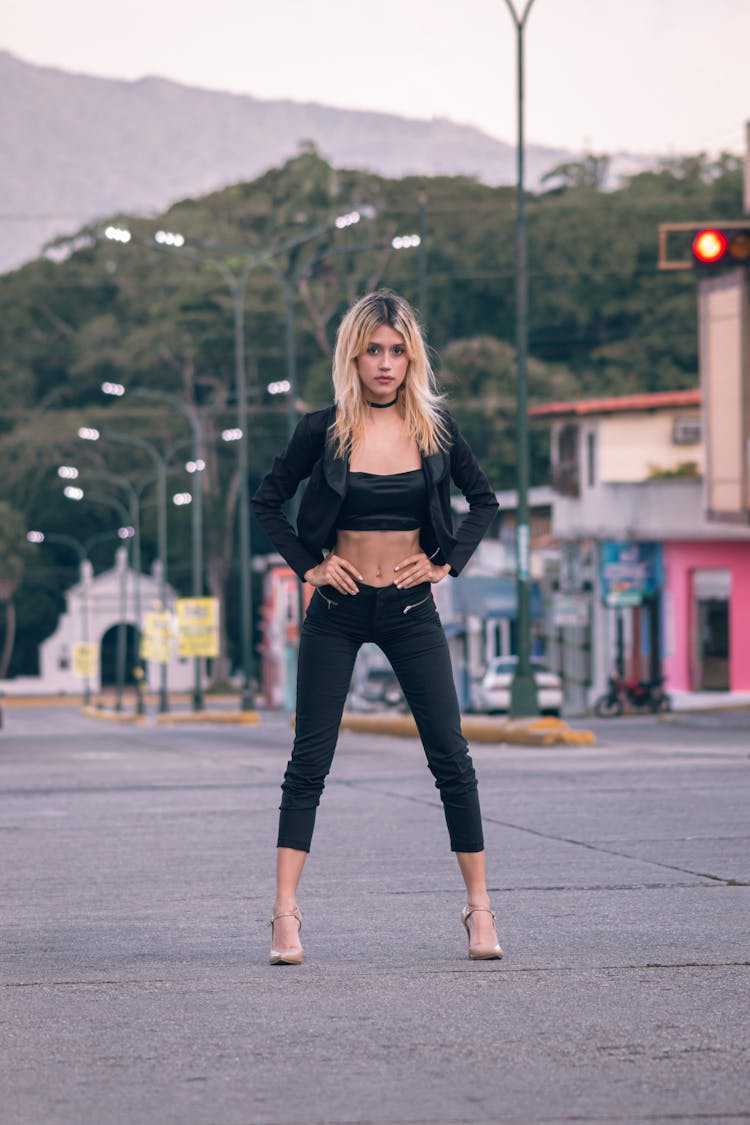 Woman Wearing Black Outfit On A Pavement 