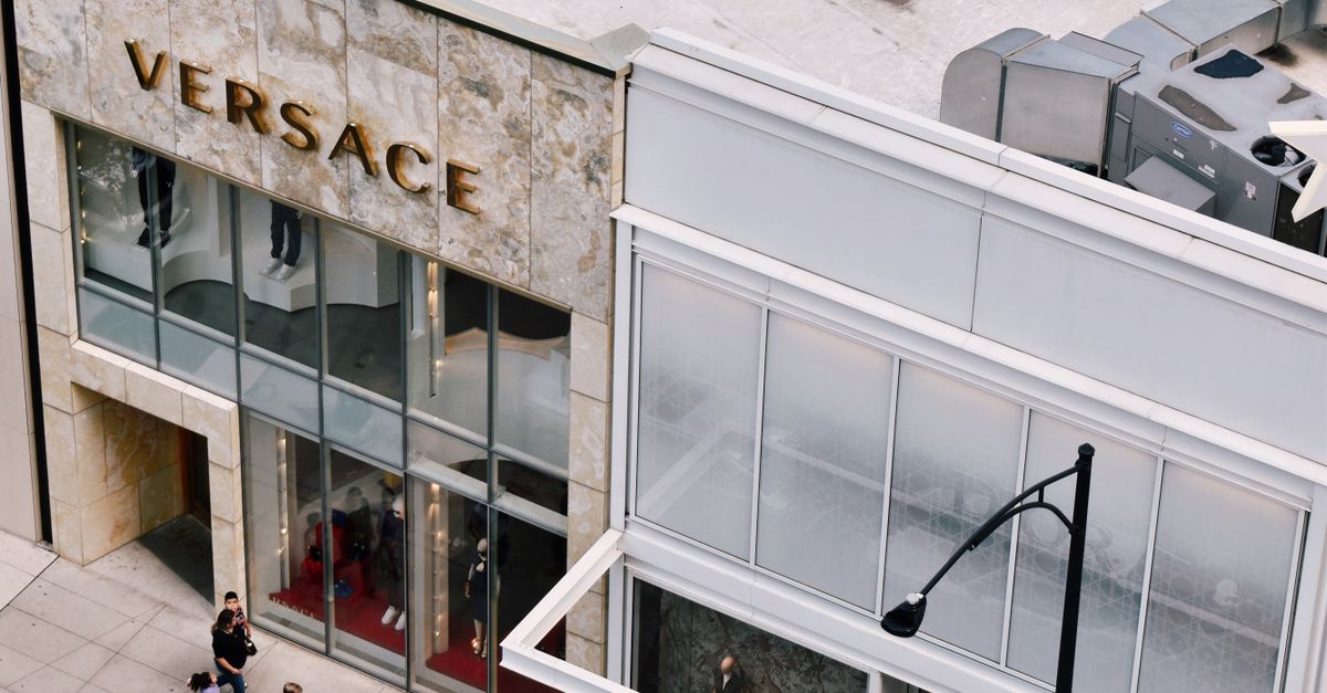 Branded Store Aerial View of Luxury Brand Stores by the Street in City · Free Stock Photo