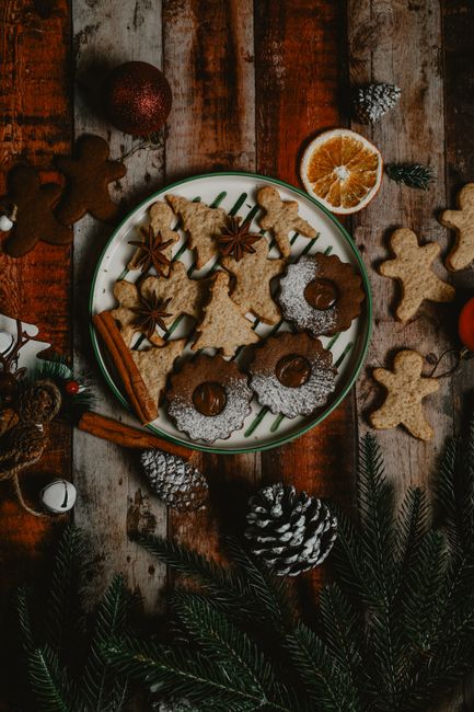 A selection of Christmas cookies with spices on a rustic wooden table in Baku, Azerbaijan.