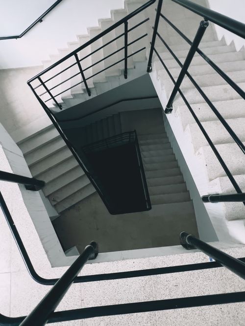 Free High angle view of spiral staircase with metal handrails in a contemporary building. Stock Photo