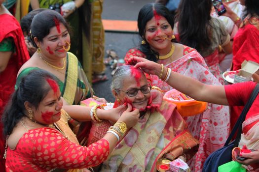 Festive gathering of women celebrating Sindoor Khela, a vibrant Hindu ritual in Kolkata.