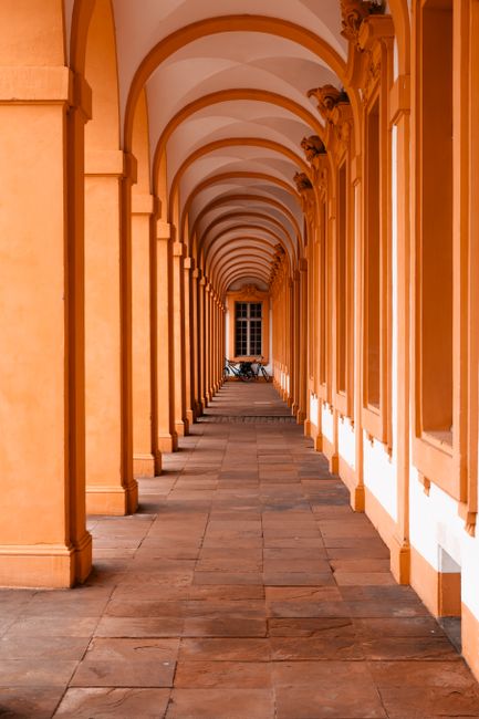 Stylish orange colonnade in Rastatt, depicting classic architectural beauty.