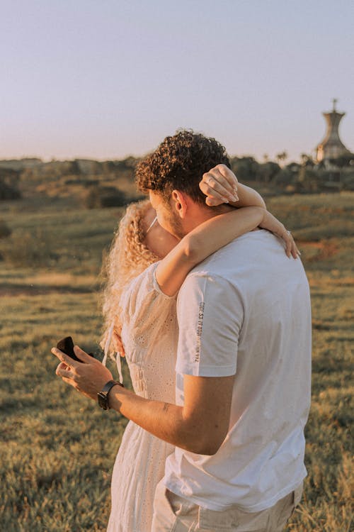 A Hugging Couple in the Field