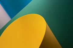 Abstract paper composition in teal and yellow — photo by Jakub Zerdzicki on Pexels