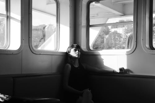Woman Sitting in a Ferry in Black and White 