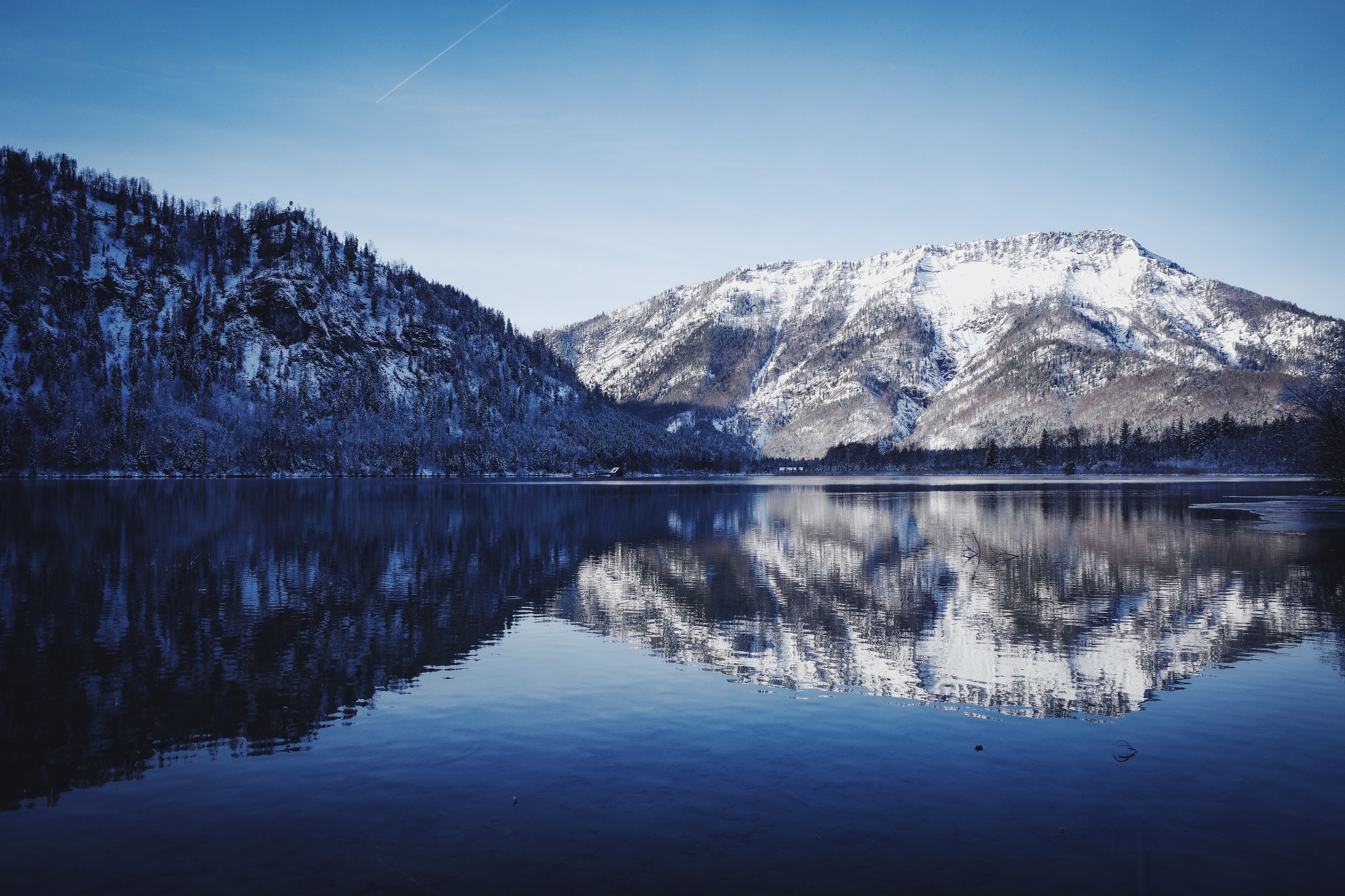 Lake Among Mountains Covered with Snow · Free Stock Photo