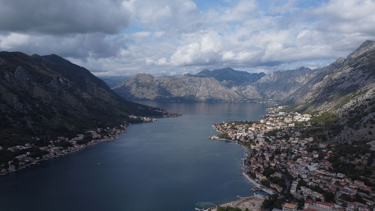 An aerial view of the medieval town of Kotor between the bay and the mountains